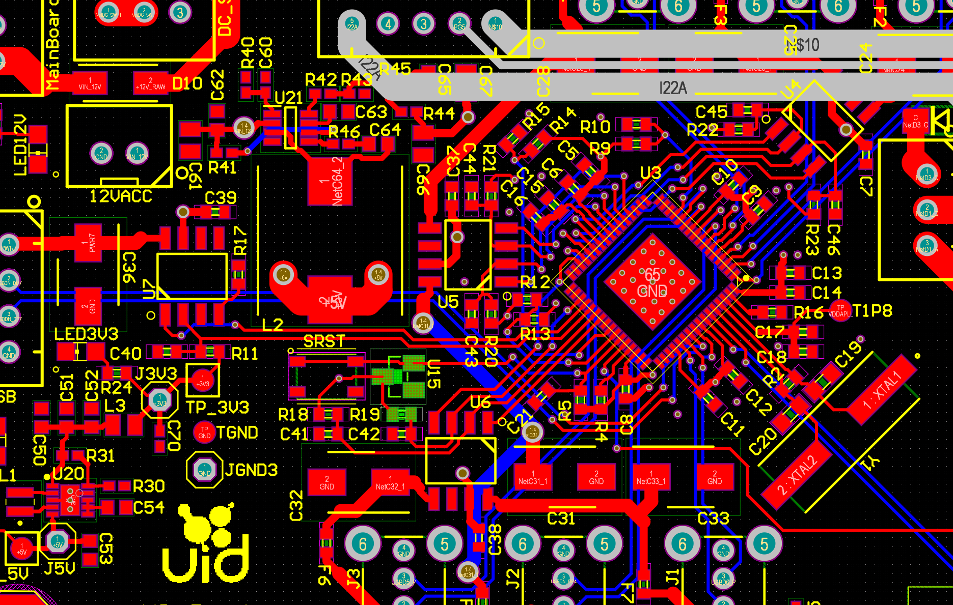 Close-up of a UID PCB layout showing copper traces, component footprints, and electrical connections