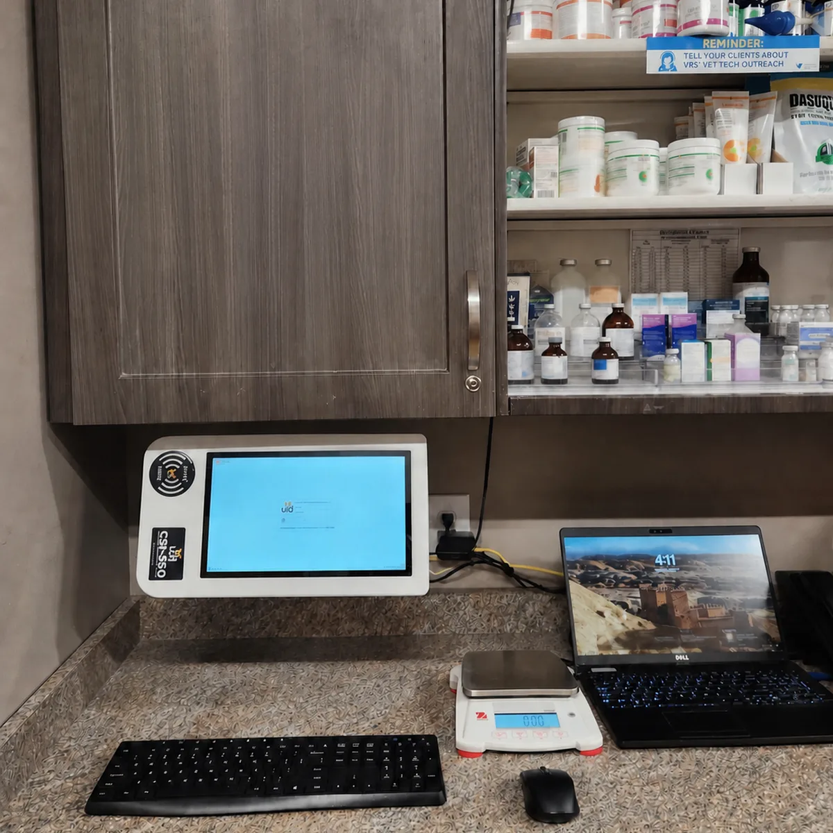 CSI-360 touch screen mounted under a medication cabinet with a digital scale on the treatment counter